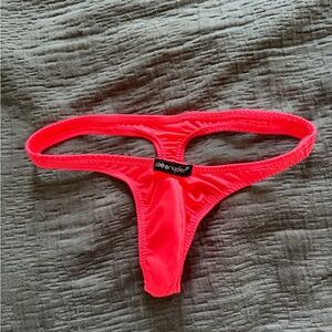 Men’s coral pink thong. Joey Snyder. Large